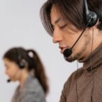 Focused call center employees wearing headsets, assisting customers with exceptional service.